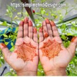 Front hand mehndi design featuring floral and paisley patterns.